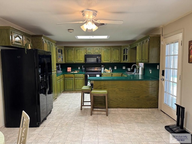 kitchen featuring ceiling fan, green cabinets, black appliances, a peninsula, and glass insert cabinets