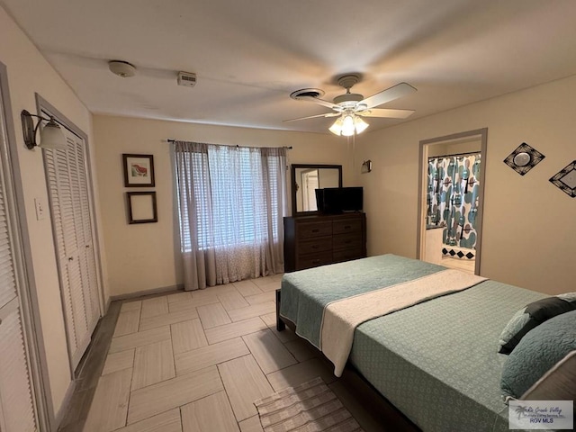 bedroom featuring baseboards and a ceiling fan