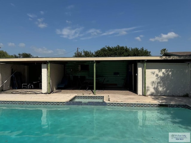 pool with a patio area
