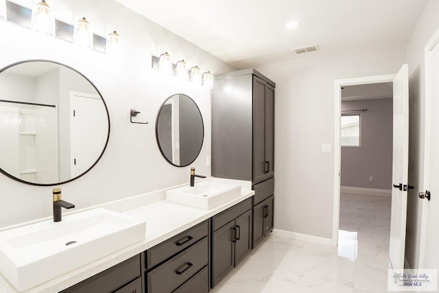 7549 Laurel Ave, Brownsville, TX 78526 - full bathroom with marble finish flooring and double vanity