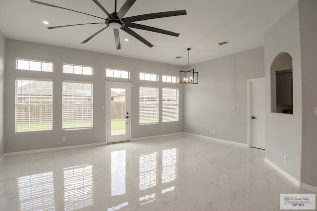 7549 Laurel Ave, Brownsville, TX 78526 - spare room with light marble finish flooring, ceiling fan, a chandelier, and recessed lighting