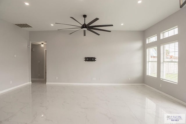 7549 Laurel Ave, Brownsville, TX 78526 - spare room with a ceiling fan, recessed lighting, and light marble finish flooring