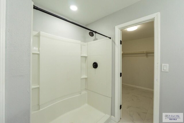 7549 Laurel Ave, Brownsville, TX 78526 - full bath featuring a shower, marble finish flooring, and a walk in closet