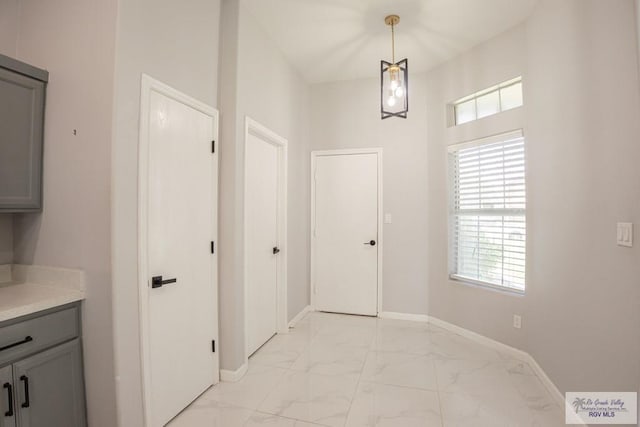 7549 Laurel Ave, Brownsville, TX 78526 - entrance foyer featuring light marble finish flooring and plenty of natural light