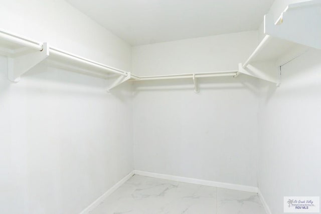 7549 Laurel Ave, Brownsville, TX 78526 - walk in closet with marble look tile flooring