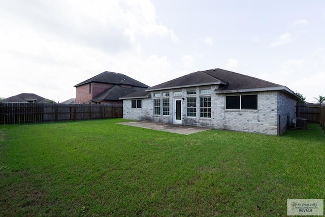 7549 Laurel Ave, Brownsville, TX 78526 - rear view of house featuring a fenced backyard, a patio, and brick siding