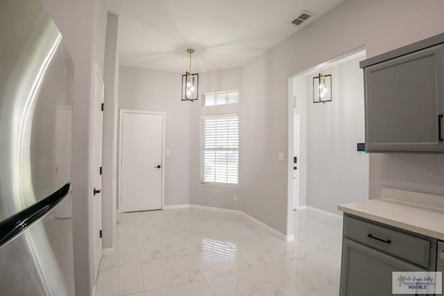 7549 Laurel Ave, Brownsville, TX 78526 - foyer featuring light marble finish floors and baseboards