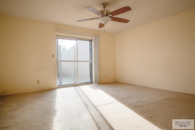 empty room with light carpet, a textured ceiling, and ceiling fan