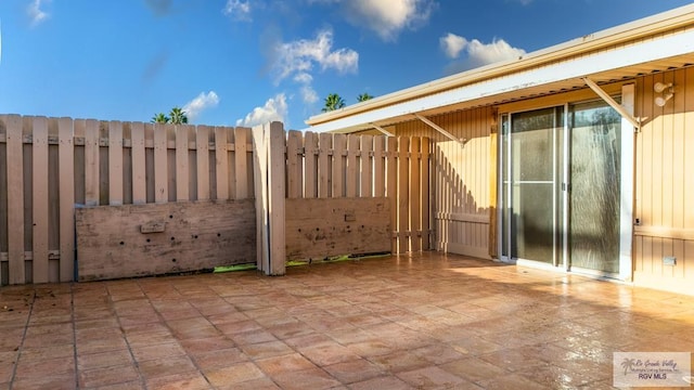 view of patio with fence