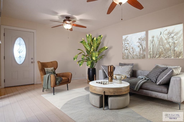 living room featuring ceiling fan and light wood-style floors