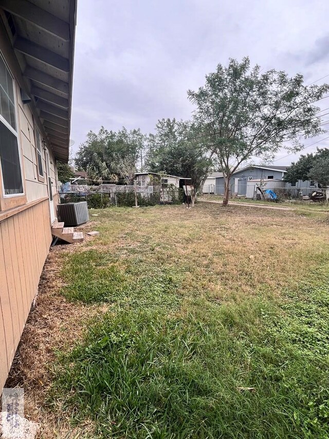 view of yard with central AC unit