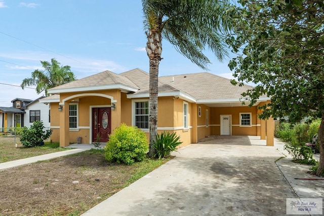 single story home with a carport