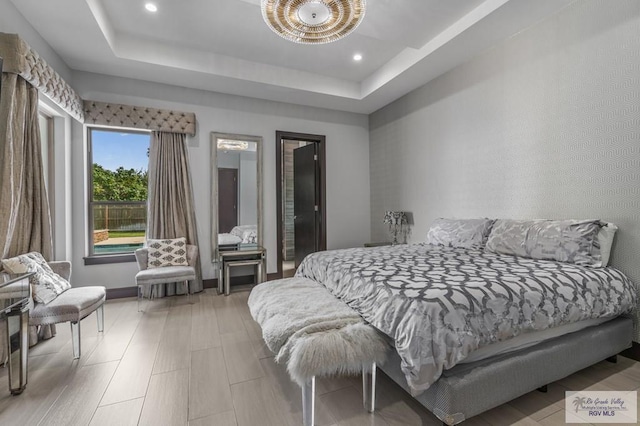 47 Medical St, Brownsville, TX 78520 - bedroom featuring a raised ceiling, recessed lighting, and baseboards