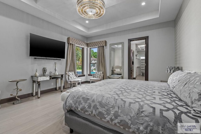47 Medical St, Brownsville, TX 78520 - bedroom with a tray ceiling, recessed lighting, baseboards, and light wood-type flooring