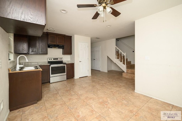 kitchen featuring dark brown cabinetry, ceiling fan, sink, electric range oven, and light tile patterned floors