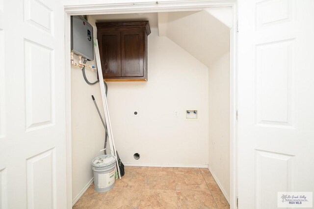 clothes washing area featuring electric dryer hookup, cabinets, and hookup for a washing machine