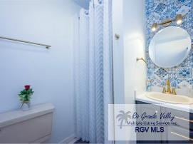 4515 Graham Rd Unit 4, Harlingen, TX 78552 - bathroom featuring vanity and toilet