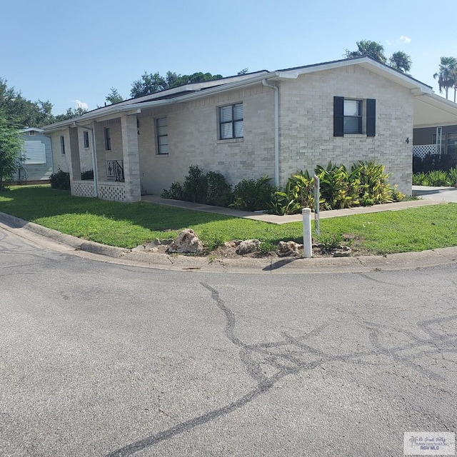 4515 Graham Rd Unit 4, Harlingen, TX 78552 - single story home with a front lawn and brick siding