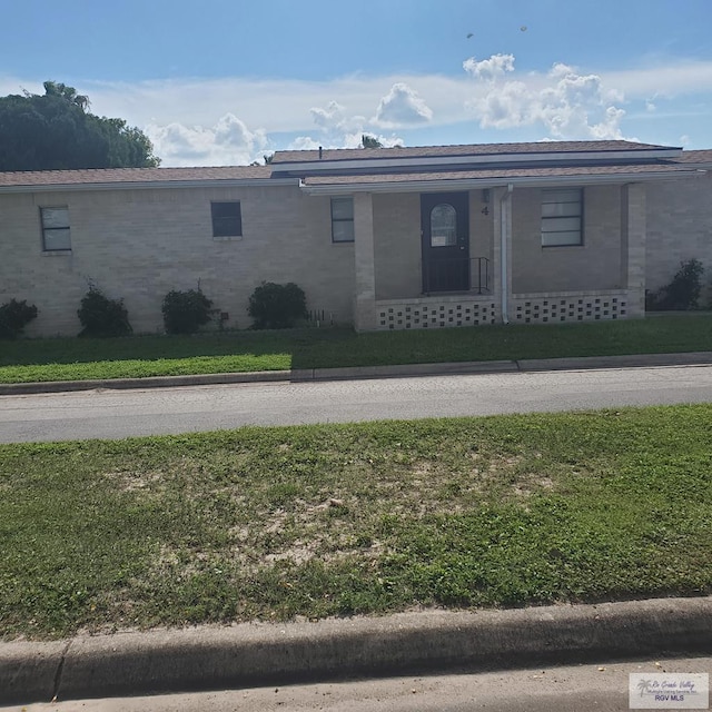 4515 Graham Rd Unit 4, Harlingen, TX 78552 - ranch-style home featuring brick siding and a front yard