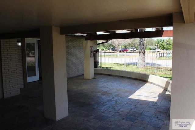 view of patio featuring fence