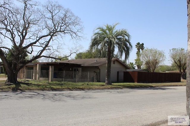 view of front of property featuring fence