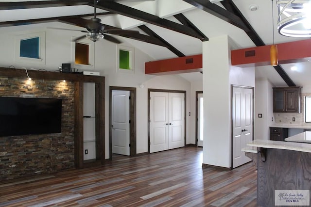 kitchen with dark brown cabinetry, a ceiling fan, backsplash, dark wood-style floors, and beamed ceiling