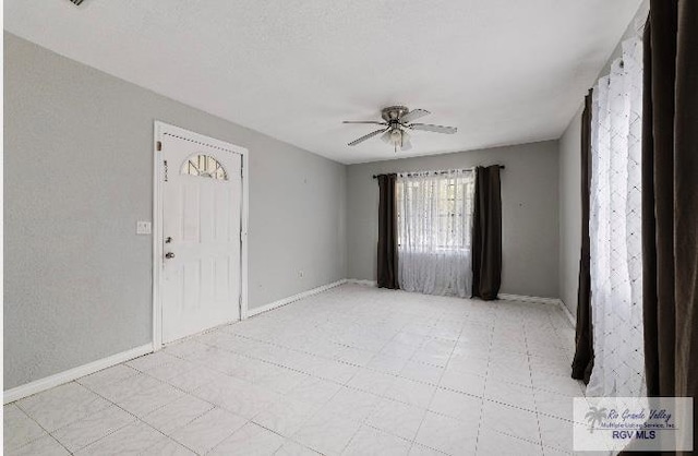 foyer featuring ceiling fan