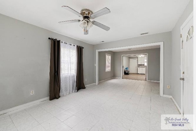 spare room with ceiling fan