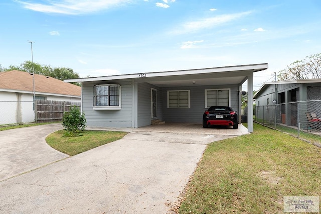 view of front of house featuring a front yard and a carport