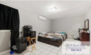 bedroom featuring an AC wall unit