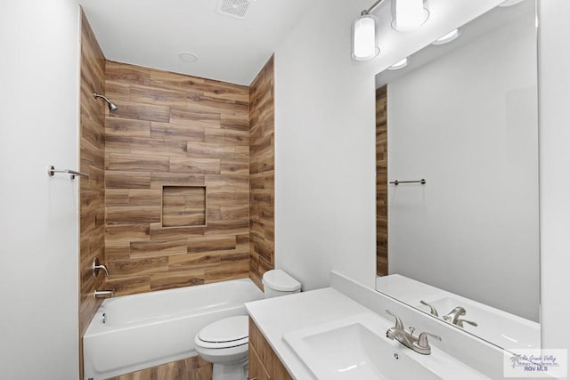 full bathroom featuring hardwood / wood-style floors, vanity, toilet, and shower / washtub combination