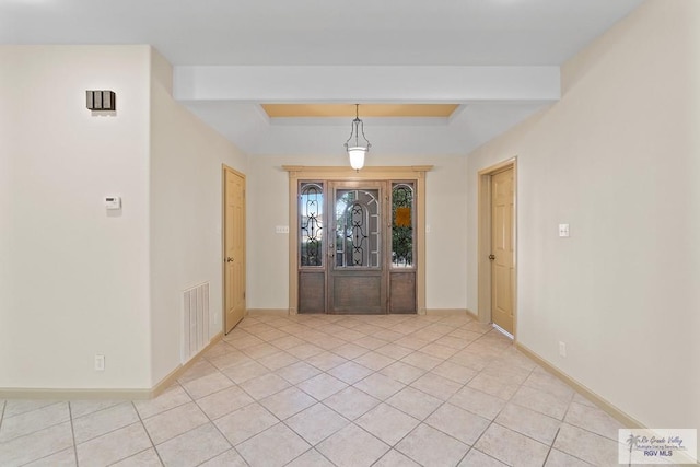 9 Sunshine Pl, Brownsville, TX 78526 - entryway featuring light tile patterned floors and a raised ceiling