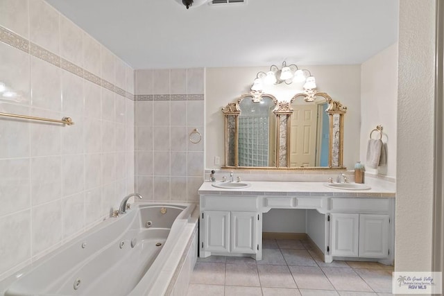 9 Sunshine Pl, Brownsville, TX 78526 - bathroom with double vanity, tile patterned floors, and a tub with jets