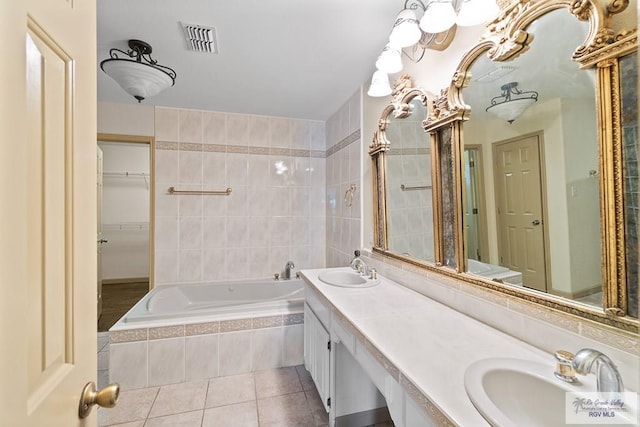 9 Sunshine Pl, Brownsville, TX 78526 - full bath featuring tile patterned flooring, a bath, and double vanity