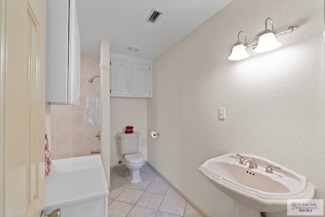 9 Sunshine Pl, Brownsville, TX 78526 - bathroom with tile patterned flooring and shower / tub combo with curtain