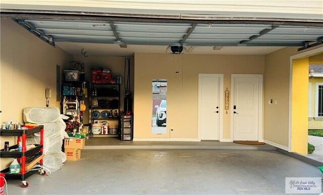 garage featuring a garage door opener