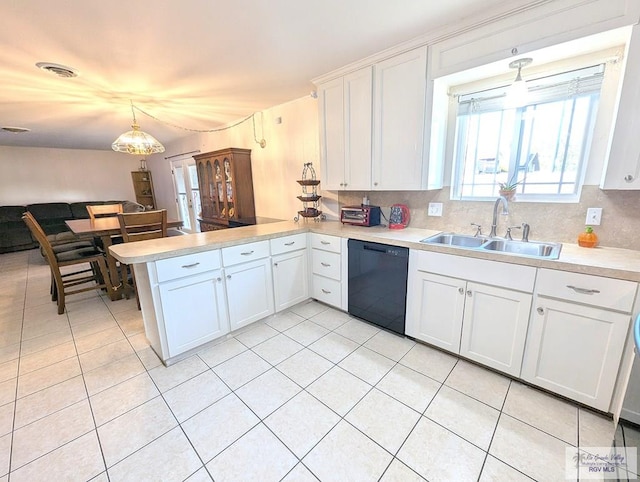 kitchen with kitchen peninsula, dishwasher, white cabinets, and pendant lighting