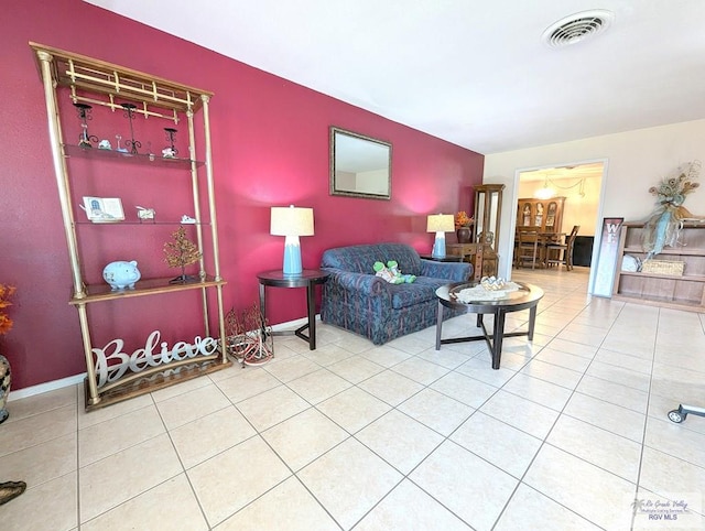 living room with tile patterned floors