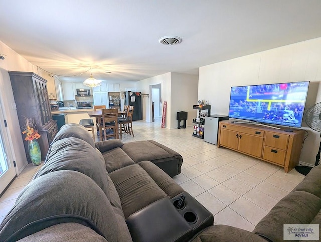 living room featuring light tile patterned flooring