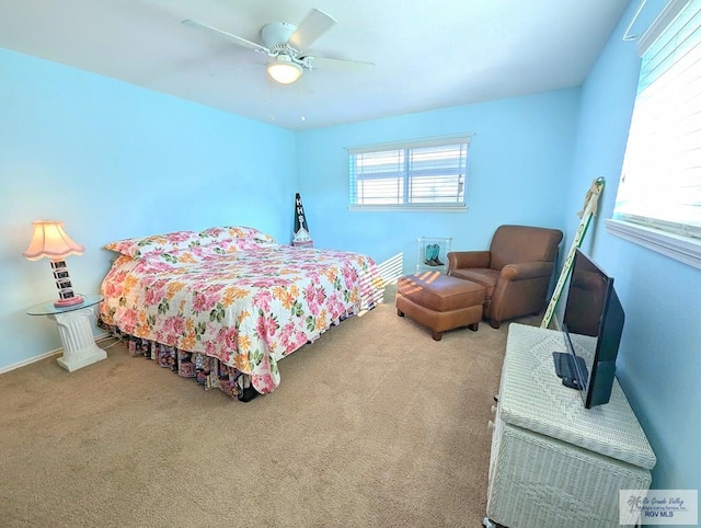 bedroom with ceiling fan and carpet floors