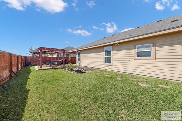 view of yard with a fenced backyard, a patio, and a pergola