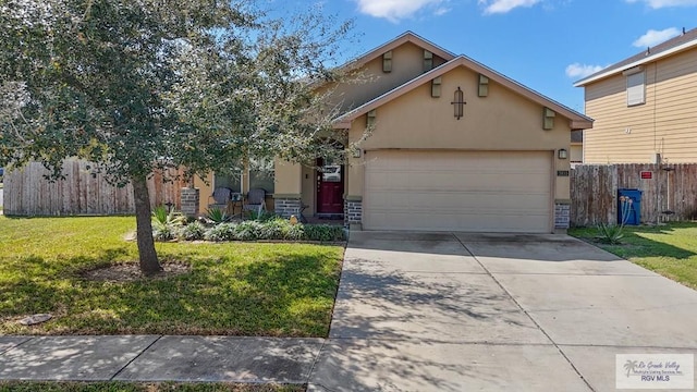 view of front of house with driveway, an attached garage, fence, a front yard, and stucco siding