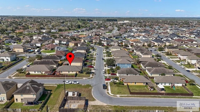 birds eye view of property with a residential view