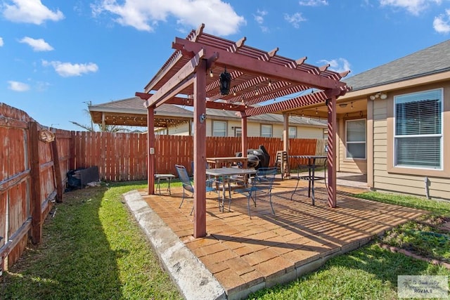 view of patio with outdoor dining area, a fenced backyard, and a pergola