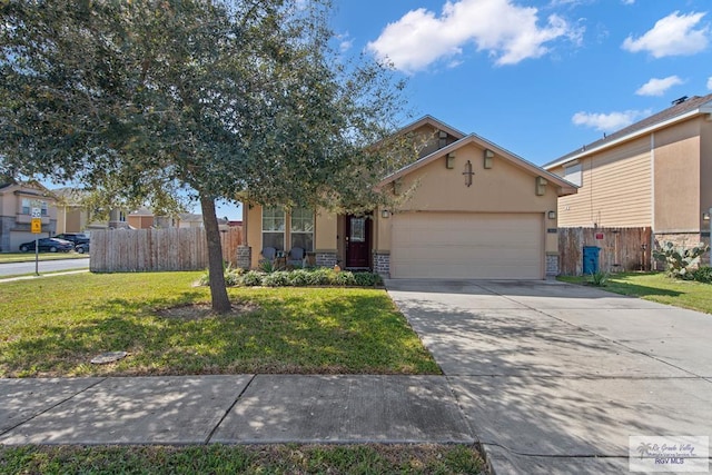 view of front of home featuring an attached garage, fence, concrete driveway, stucco siding, and a front yard