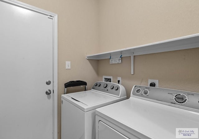 clothes washing area featuring laundry area and independent washer and dryer