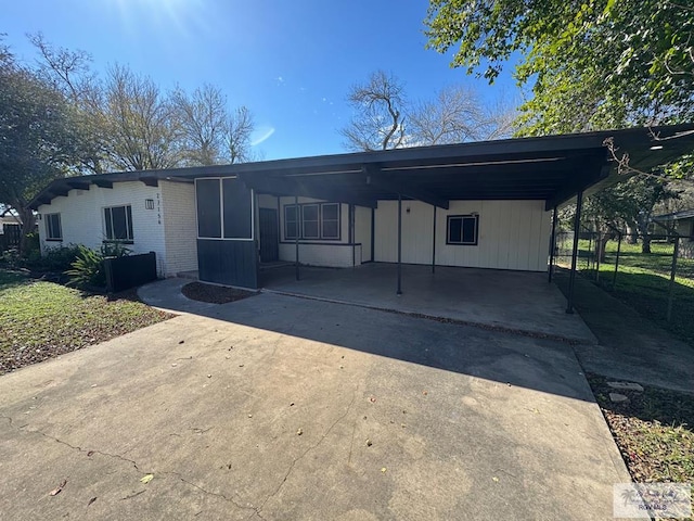 view of front of home with a carport