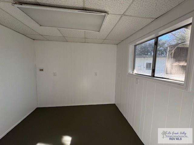 unfurnished room with a paneled ceiling