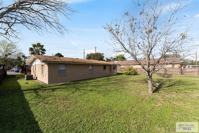 view of yard with central AC unit