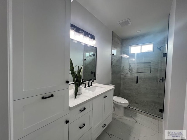 bathroom featuring walk in shower, vanity, and toilet